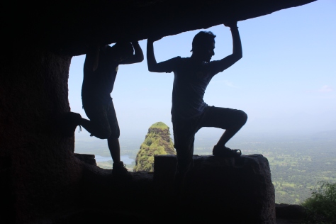 Naveen and Dinesh trying to lift the imaginary Goavardhan Mountain (Cave)